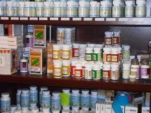 Various white containers placed on the shelves